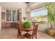 Charming breakfast nook with a wooden table and built-in wet bar at 37295 N Boulder View Dr, Scottsdale, AZ 85262