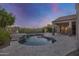 Inviting kidney shaped pool with flagstone patio and fire pit at 4706 S Primrose Dr, Gold Canyon, AZ 85118