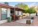 Relaxing patio area with table and chairs, adjacent to the house at 25629 S Ontario Dr, Sun Lakes, AZ 85248