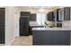 Modern kitchen with dark cabinets and granite countertops at 11235 E Pampa Ave, Mesa, AZ 85212