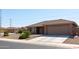 House exterior with a two-car garage and desert landscaping at 11235 E Pampa Ave, Mesa, AZ 85212