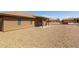Spacious backyard with gravel and covered patio at 11235 E Pampa Ave, Mesa, AZ 85212