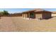 Large backyard with gravel and covered patio at 11235 E Pampa Ave, Mesa, AZ 85212