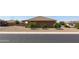 Side yard view of a house with desert landscaping at 11235 E Pampa Ave, Mesa, AZ 85212