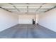 Two-car garage with concrete flooring at 11235 E Pampa Ave, Mesa, AZ 85212