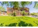 Two-story house exterior with stone accents and a covered patio at 15512 E Desert Hawk Trl, Fountain Hills, AZ 85268