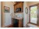 Convenient wet bar with granite countertop and mini-refrigerator at 15512 E Desert Hawk Trl, Fountain Hills, AZ 85268