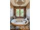 Spa-like bathroom with large circular tub and a tranquil view at 15512 E Desert Hawk Trl, Fountain Hills, AZ 85268