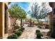 Landscaped courtyard with fountain and stone pathways at 15512 E Desert Hawk Trl, Fountain Hills, AZ 85268