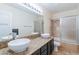 Bathroom boasts double sinks, granite countertop, and shower/tub combo at 5540 W Lone Cactus Dr, Glendale, AZ 85308