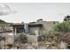 Modern desert home with stone accents and landscaped yard at 10071 E Aniko Dr, Scottsdale, AZ 85262