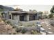 Luxury home with stone and stucco exterior, and a 3-car garage at 10071 E Aniko Dr, Scottsdale, AZ 85262