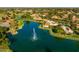 Community aerial view showcasing a lake with fountain and homes at 1729 Leisure World --, Mesa, AZ 85206