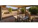 Covered patio offers a relaxing space with table and chairs at 1729 Leisure World --, Mesa, AZ 85206