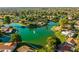 Aerial view of community with lake and surrounding houses at 1729 Leisure World --, Mesa, AZ 85206