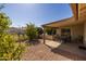 Covered patio with table and chairs, ideal for outdoor dining at 1729 Leisure World --, Mesa, AZ 85206