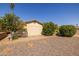 Landscaped backyard with gravel and mature trees at 1729 Leisure World --, Mesa, AZ 85206