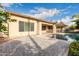 Inviting backyard with covered patio, pool, and lush landscaping at 4709 E Ironhorse Rd, Gilbert, AZ 85297