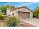 Single-story home with two-car garage and desert landscaping at 27476 N 125Th Dr, Peoria, AZ 85383