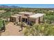 Aerial view of a large, stucco home with desert landscaping at 26615 N 71St Pl, Scottsdale, AZ 85266