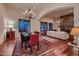 Elegant dining room with hardwood floors and a chandelier at 26615 N 71St Pl, Scottsdale, AZ 85266