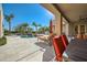 Inviting backyard with a pool, patio furniture, and built-in grill at 26615 N 71St Pl, Scottsdale, AZ 85266