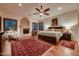Large main bedroom with fireplace and wood floors at 26615 N 71St Pl, Scottsdale, AZ 85266
