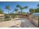 Landscaped backyard with a built-in barbecue and seating area at 26615 N 71St Pl, Scottsdale, AZ 85266