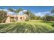 Landscaped backyard with expansive lawn and mature trees at 26615 N 71St Pl, Scottsdale, AZ 85266