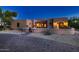 Exterior of a stucco home with a brick driveway at dusk at 26615 N 71St Pl, Scottsdale, AZ 85266