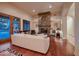 Cozy living room featuring a fireplace and hardwood floors at 26615 N 71St Pl, Scottsdale, AZ 85266