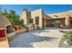 Outdoor kitchen and seating area with a fireplace and built-in grill at 26615 N 71St Pl, Scottsdale, AZ 85266