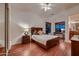 Bright bedroom featuring hardwood floors and a comfortable bed at 26615 N 71St Pl, Scottsdale, AZ 85266