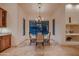 Bright breakfast nook with a table for four and large windows at 26615 N 71St Pl, Scottsdale, AZ 85266