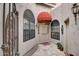 Inviting entryway with arched windows and terracotta tile floor at 8870 E Greenview Dr, Gold Canyon, AZ 85118