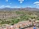 Aerial view of community, golf course and mountains at 8870 E Greenview Dr, Gold Canyon, AZ 85118