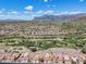 Aerial view of community near golf course and mountains at 8870 E Greenview Dr, Gold Canyon, AZ 85118