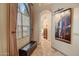 Hallway with large artwork and access to bathroom at 8870 E Greenview Dr, Gold Canyon, AZ 85118