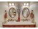 Clean bathroom with double sinks and updated light fixtures at 8870 E Greenview Dr, Gold Canyon, AZ 85118
