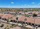Aerial view of community with Spanish-style homes and desert landscape at 8870 E Greenview Dr, Gold Canyon, AZ 85118
