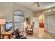 Bright home office space with built-in shelving and large window at 8870 E Greenview Dr, Gold Canyon, AZ 85118