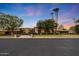Luxury home exterior with stone accents and palm trees at 6107 E Paradise Dr, Scottsdale, AZ 85254