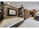 Spa-like bathroom with a soaking tub, glass shelving, and patterned wallpaper at 6107 E Paradise Dr, Scottsdale, AZ 85254