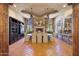 Formal dining room with a fireplace and large windows at 6107 E Paradise Dr, Scottsdale, AZ 85254