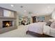 Spacious bedroom with fireplace, sitting area, and large bed at 6107 E Paradise Dr, Scottsdale, AZ 85254