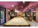 Game room featuring a pool table, wet bar, and comfortable seating at 6107 E Paradise Dr, Scottsdale, AZ 85254