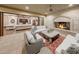 Outdoor patio with stone fireplace, comfortable seating and access to interior living space at 6107 E Paradise Dr, Scottsdale, AZ 85254
