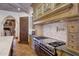 Luxury kitchen with professional-grade range and custom backsplash at 6107 E Paradise Dr, Scottsdale, AZ 85254