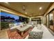 Spacious outdoor patio with seating and a fire place at 6107 E Paradise Dr, Scottsdale, AZ 85254
