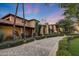Elegant home with stone facade and landscaped entryway at 6107 E Paradise Dr, Scottsdale, AZ 85254